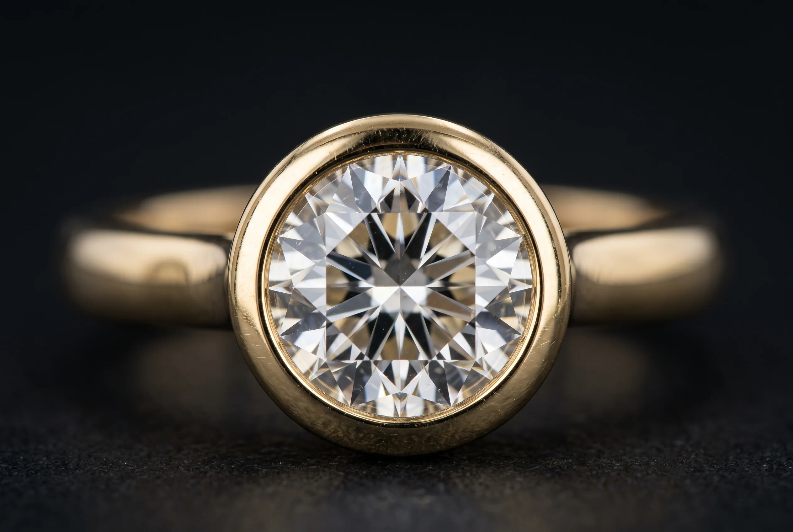 Macro of a bezel setting, the metal rim wrapping the girdle of the stone