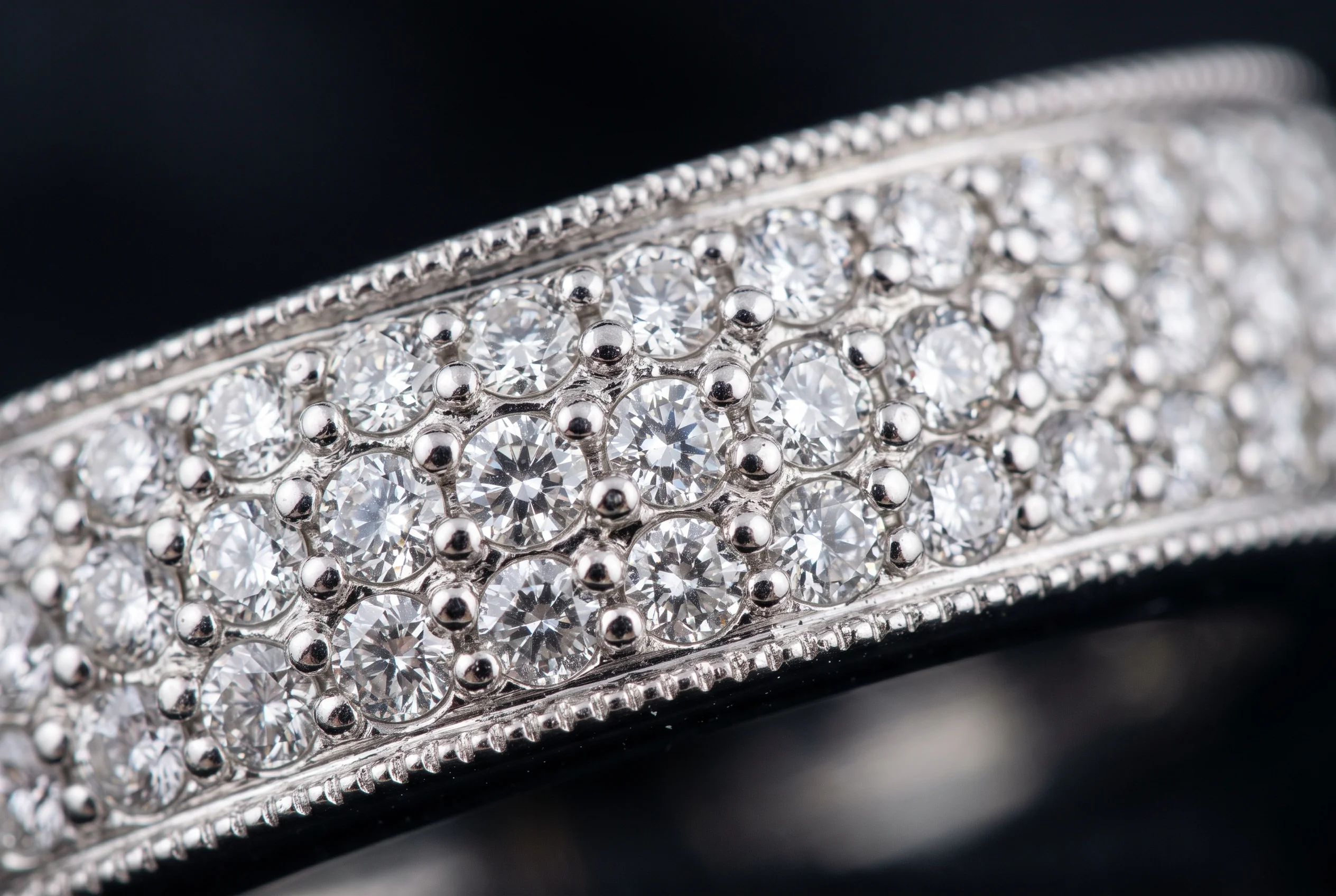 Macro of a pavé setting, many small stones held close together with little metal between them